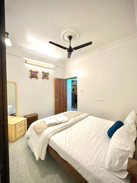 Maraga Inn Deluxe AC Room Interior with Comfortable Beds